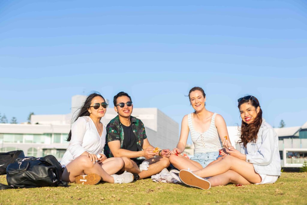 Students socialising on a beach in Western Australia